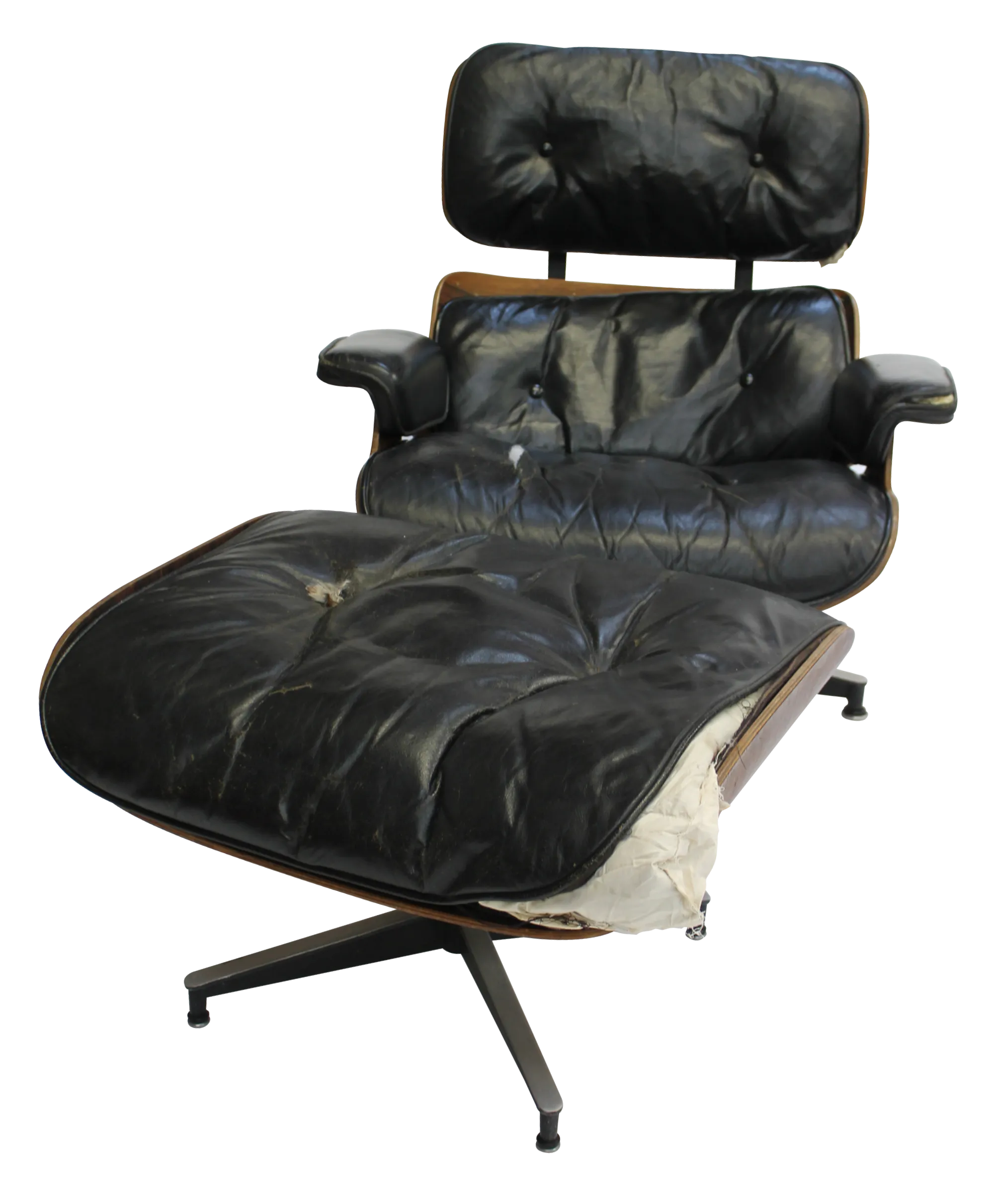 tattered and torn Eames Lounge Chair and ottoman